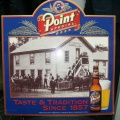 A Stevens Point Brewery tin sign.